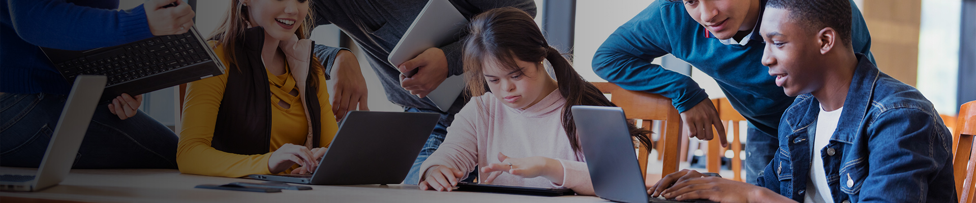Students in classroom using mobile devices