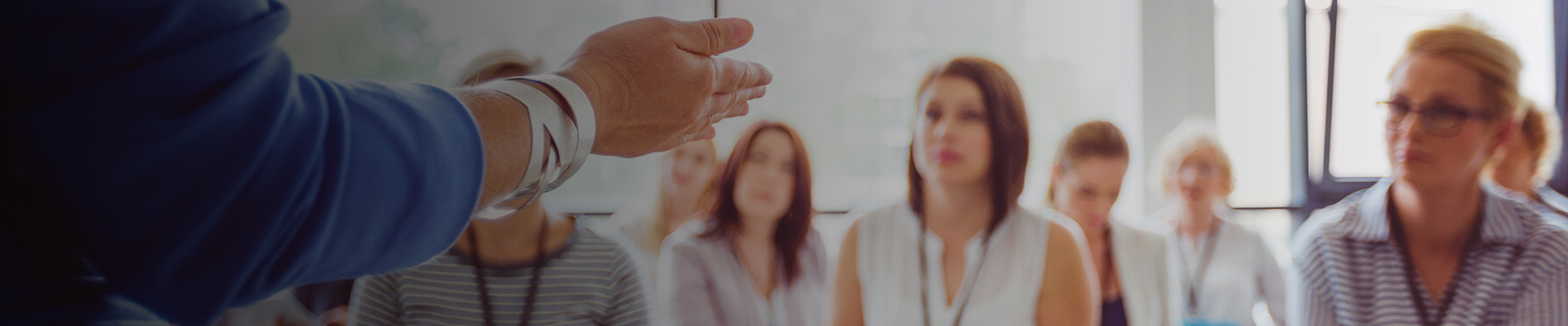 Teacher presenting to students in university